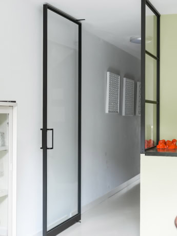 Black pivot door with slim frames