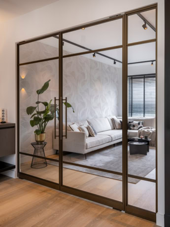 Bronze pivot door with slim frames